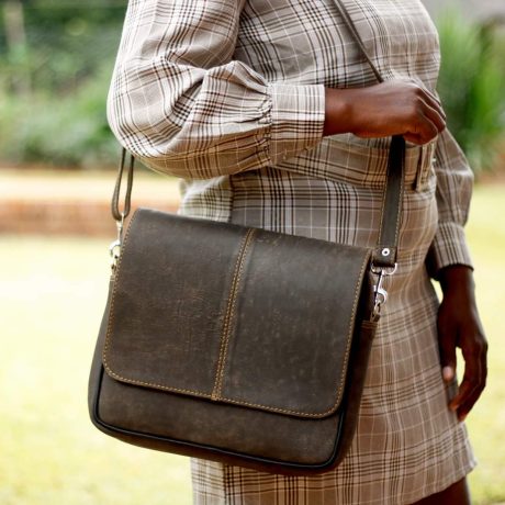 Woman carrying leather bag made by EdStel Leather in Zimbabwe